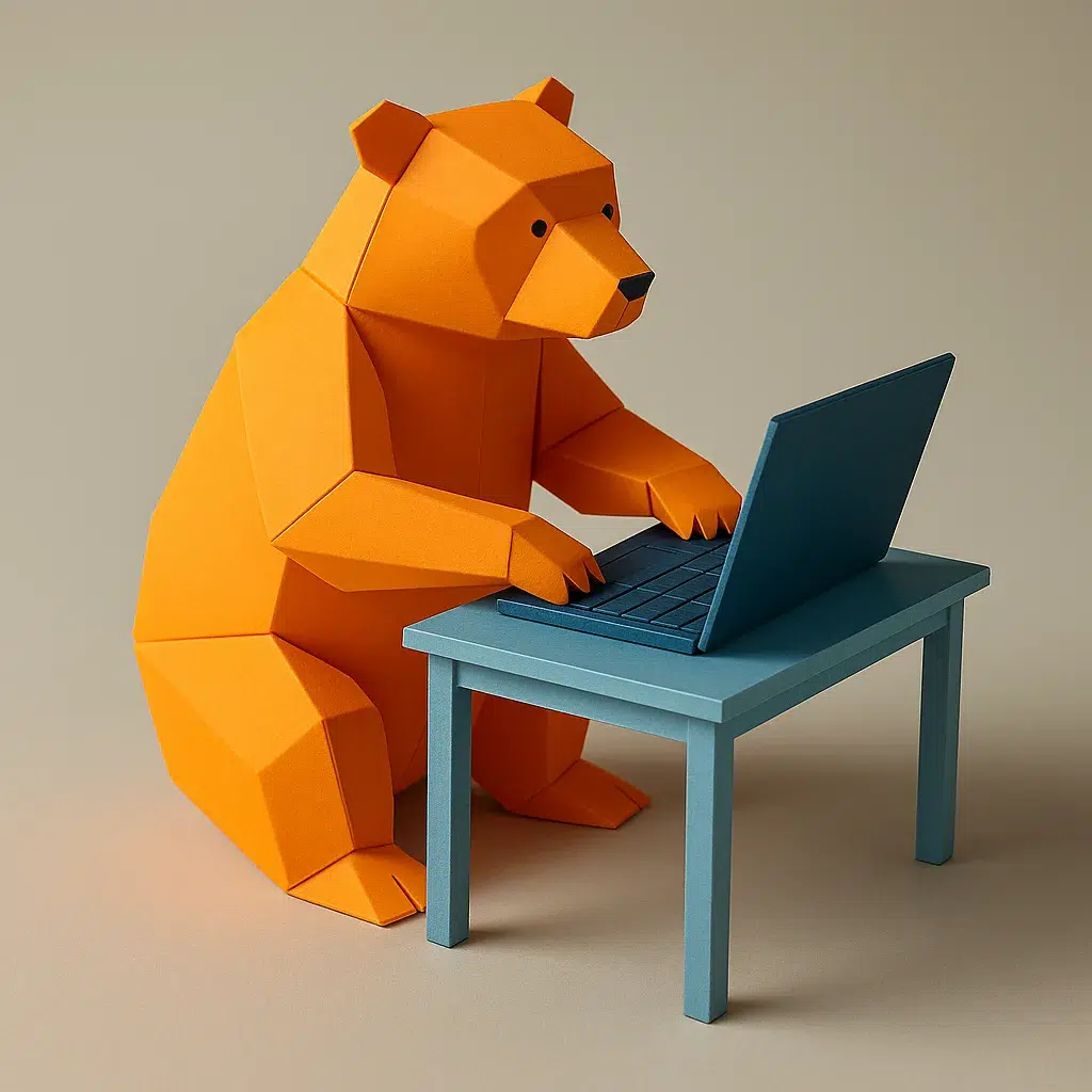 un ours en origami orange, couleur de l'entreprise Les Vikings, assis sur le sol et en train de coder un site web ou un site e-commerce